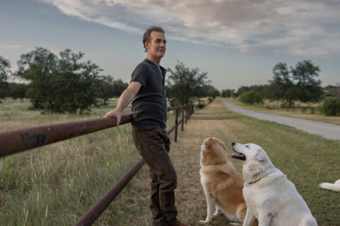 James Van Der Beek with his dogs on his ranch