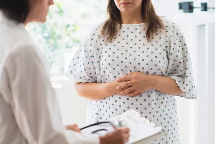 Female physician and a female patient discuss.